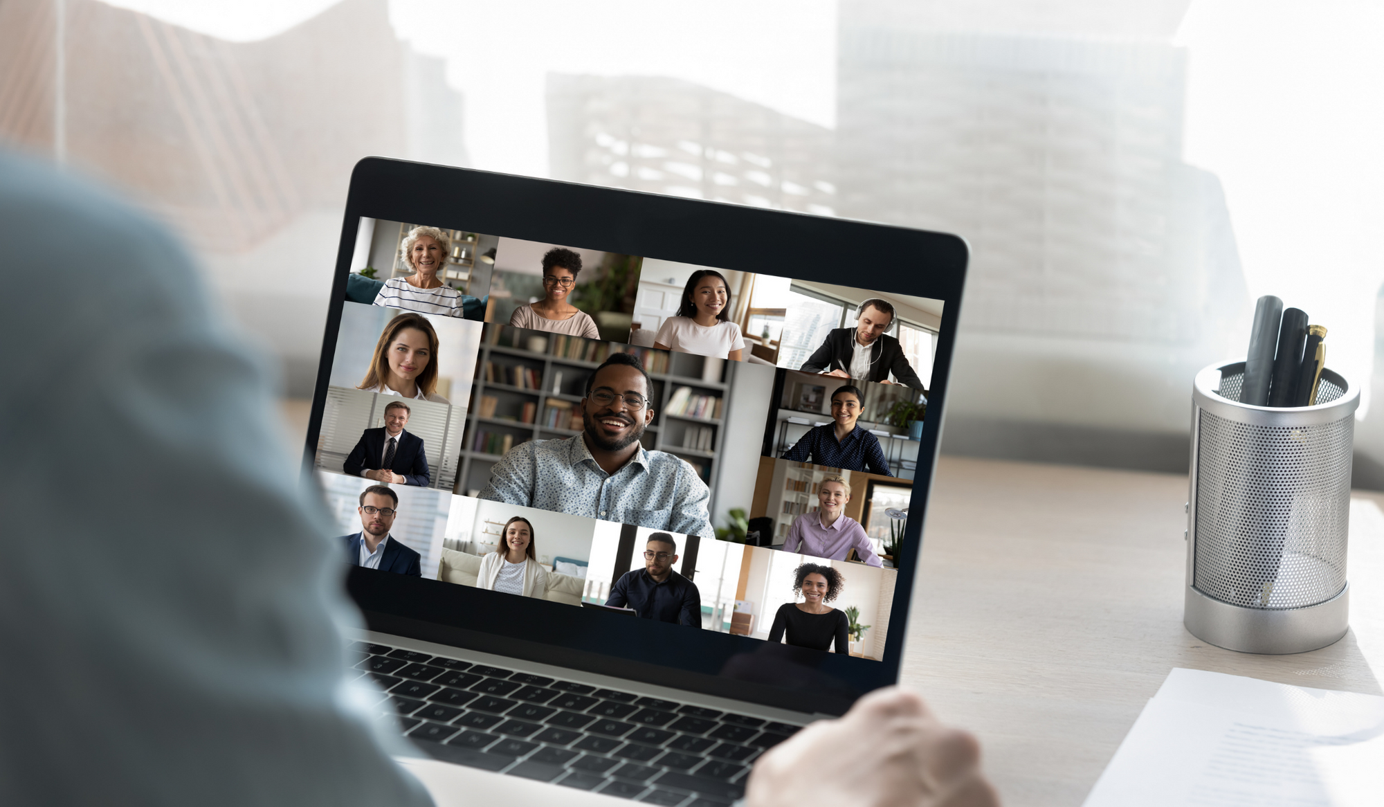 A person having a video conference call with several of his/her teammmates