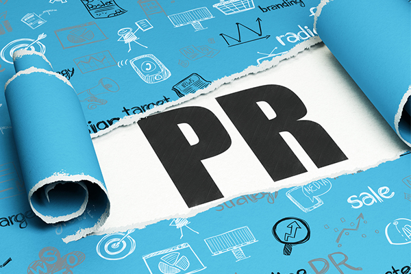 A torn marketing wallpaper with the text 'PR' inside
