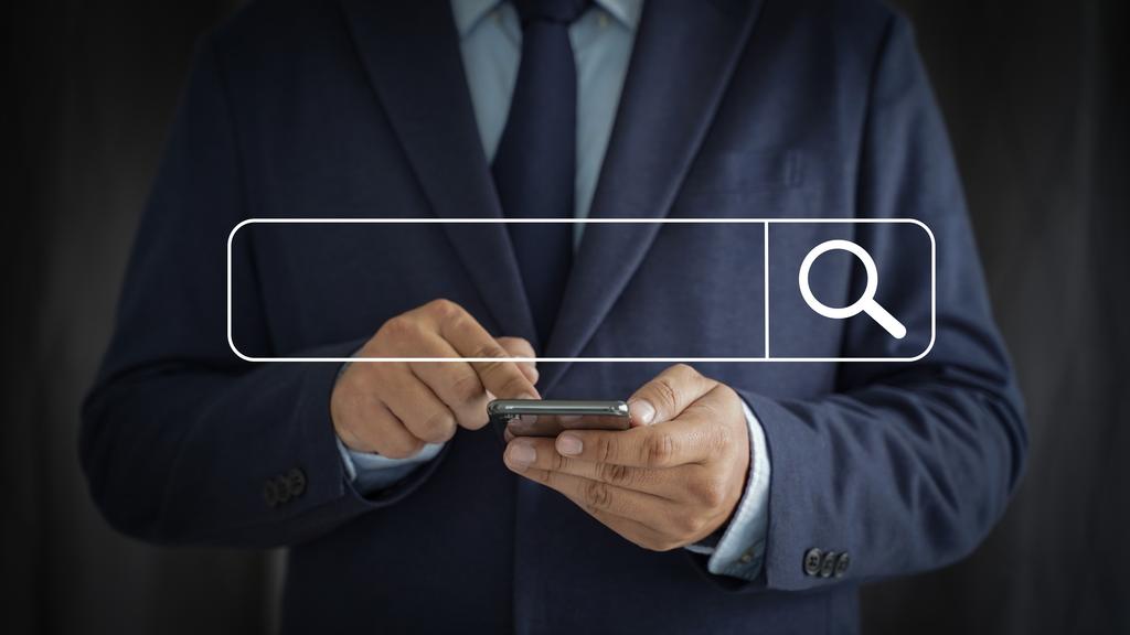A search bar and a man using his phone