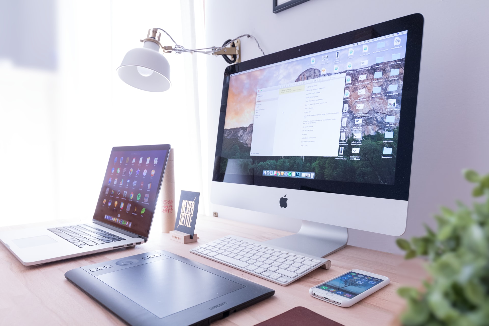 Laptop and macbook over a wooden desk