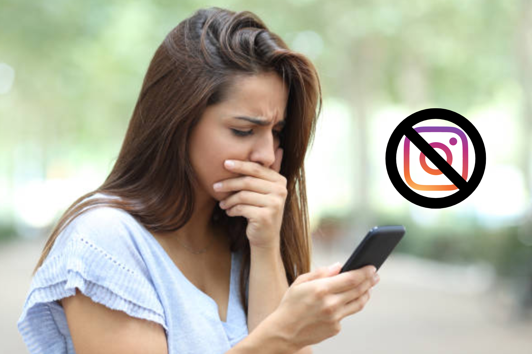 A woman was shocked in front of her phone, which displayed a blocked Instagram logo
