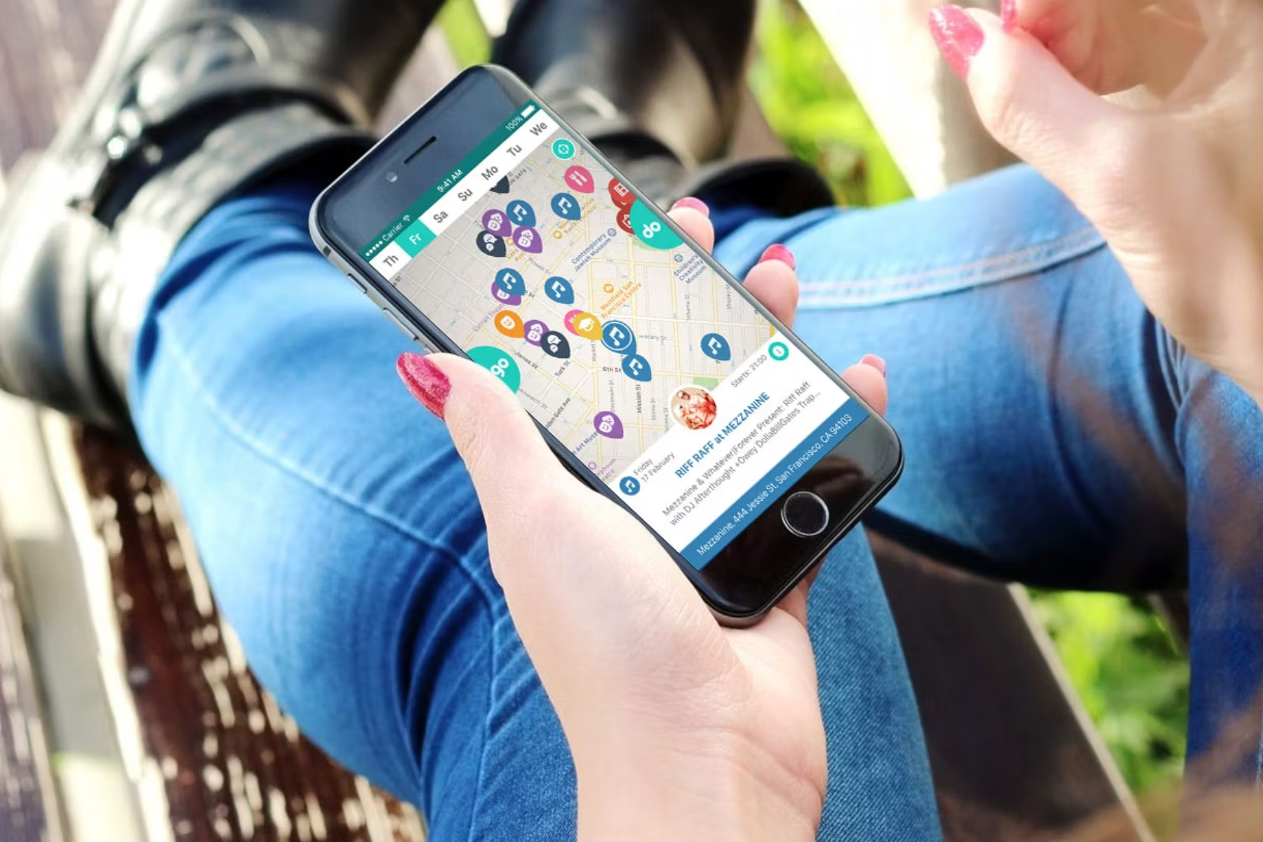 A woman searching on her iPhone for local events