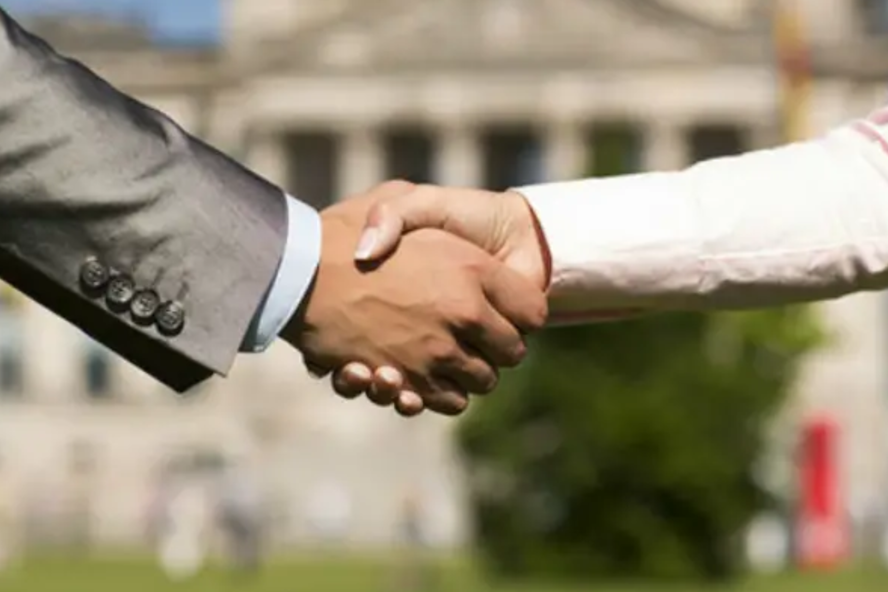 A business associate shakes hands