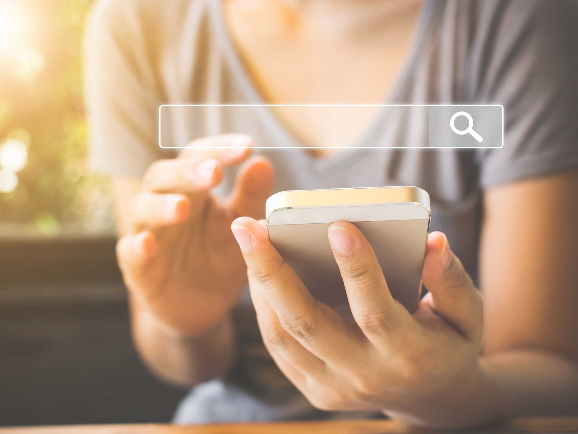 A girl typing in a phone and search bar