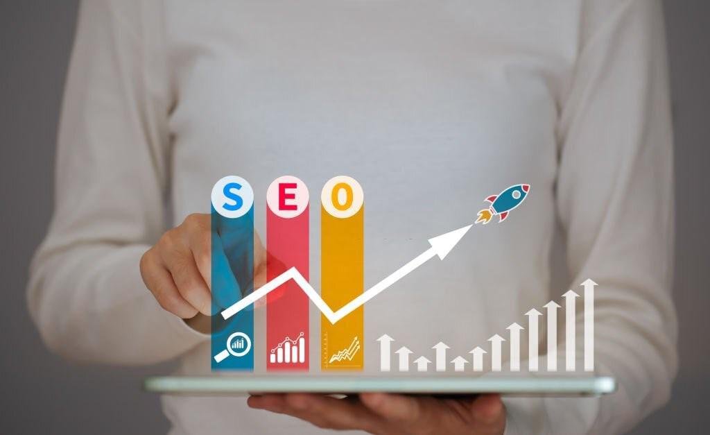 SEO bar graph with line and arrow graph and a man holding a tablet