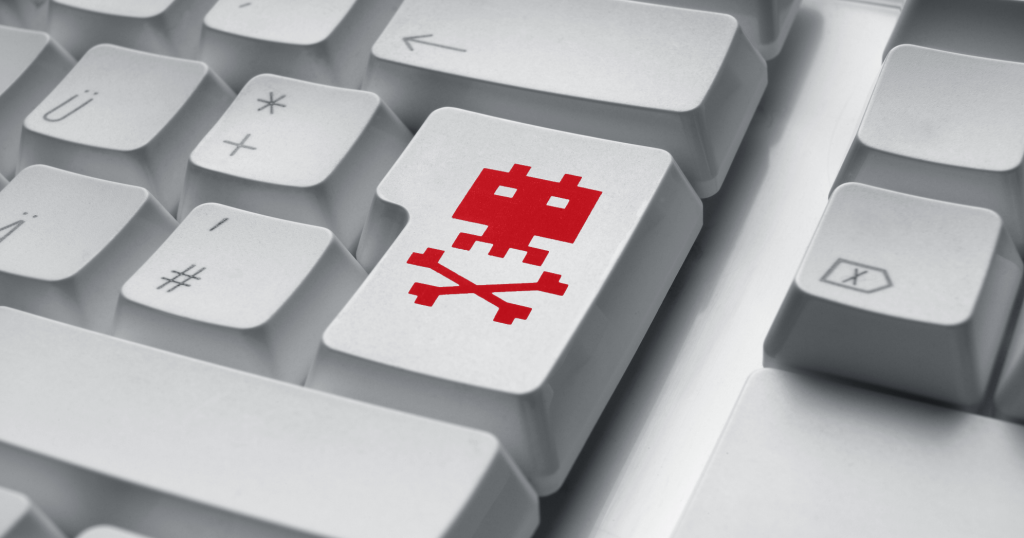 A white keyboard with red skull on enter key