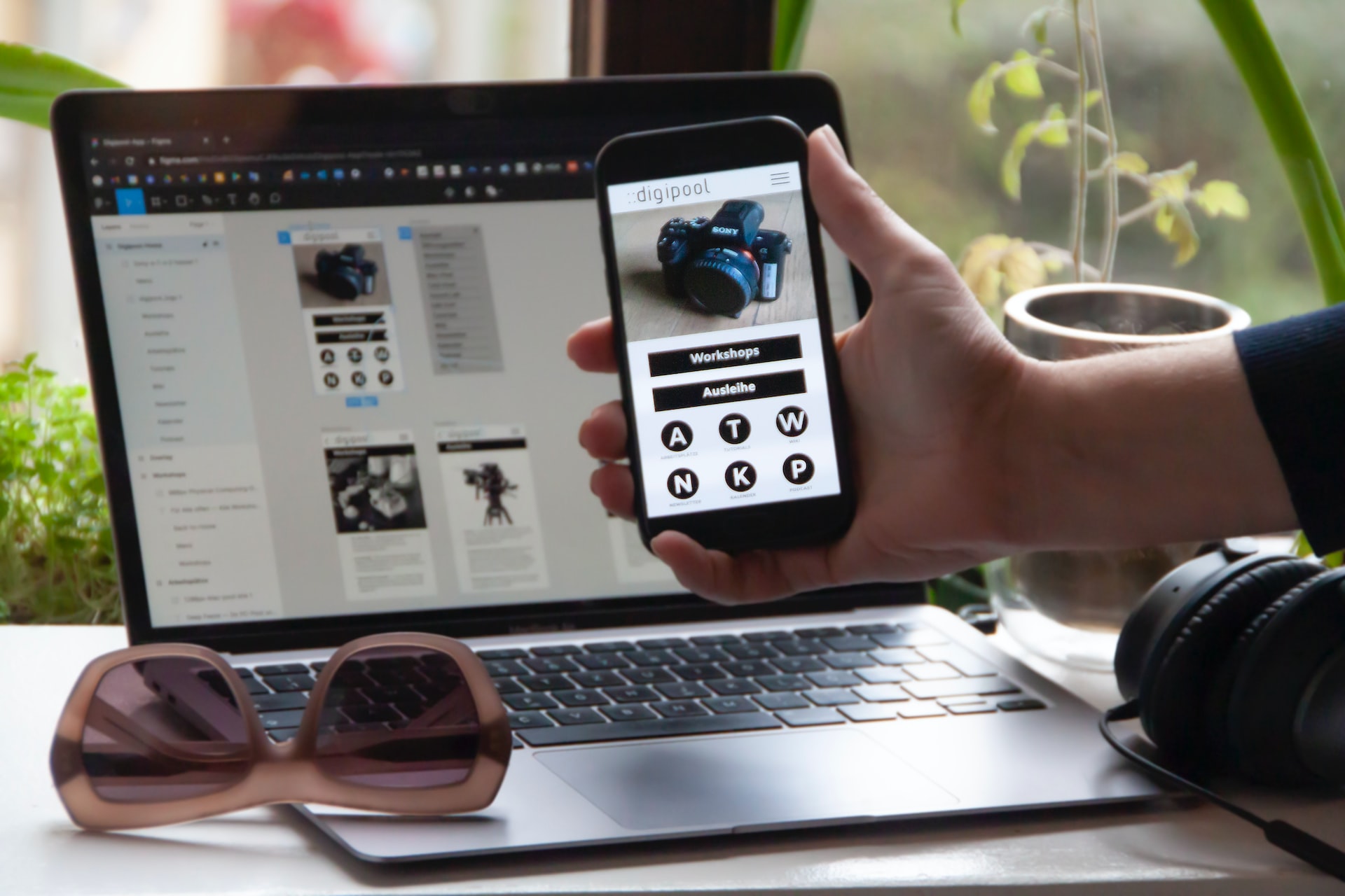 Man using his cellphone and laptop with a online store app