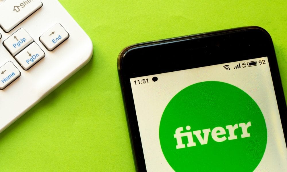 Fiverr app logo on the phone