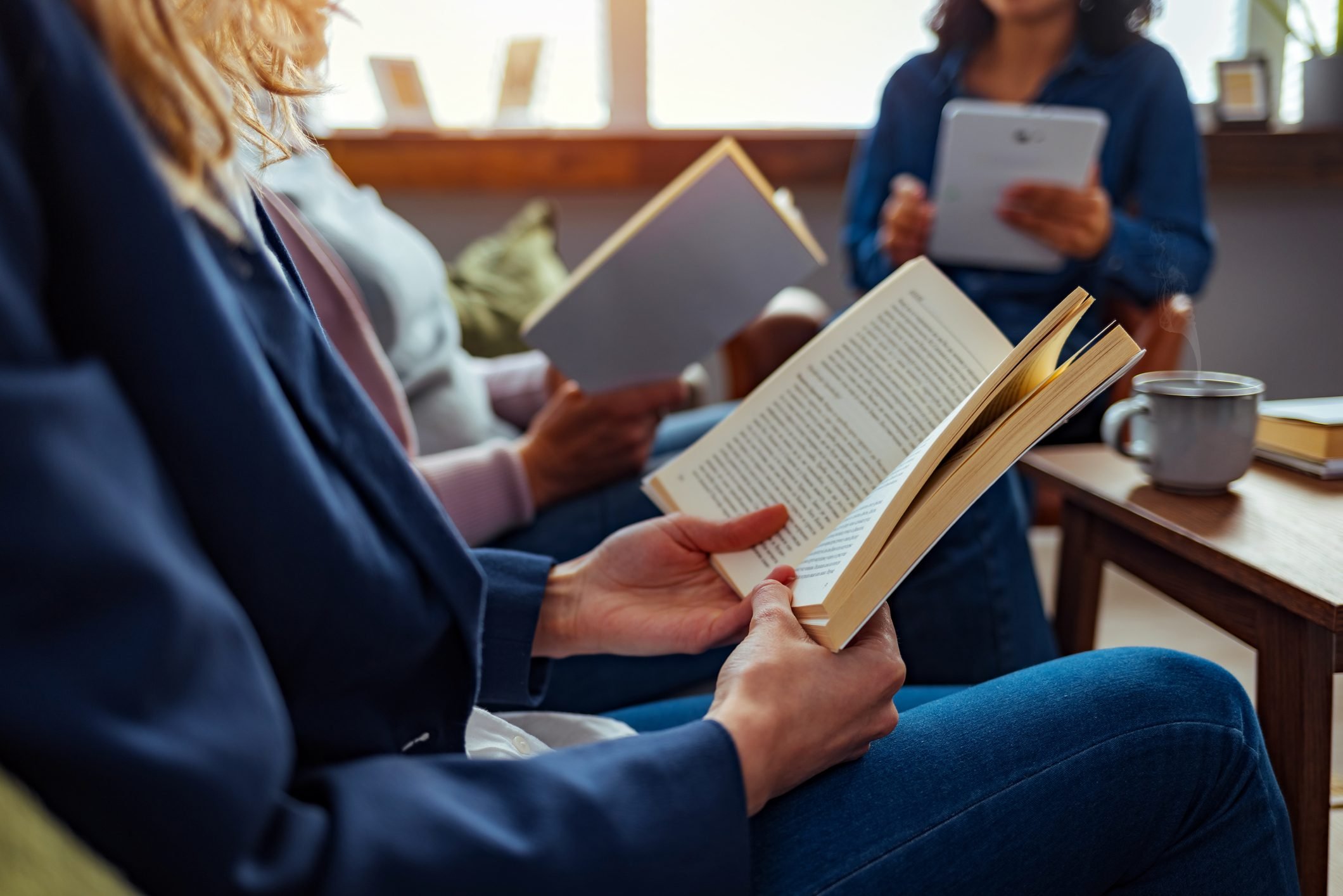 People reading the same book in A Book Club