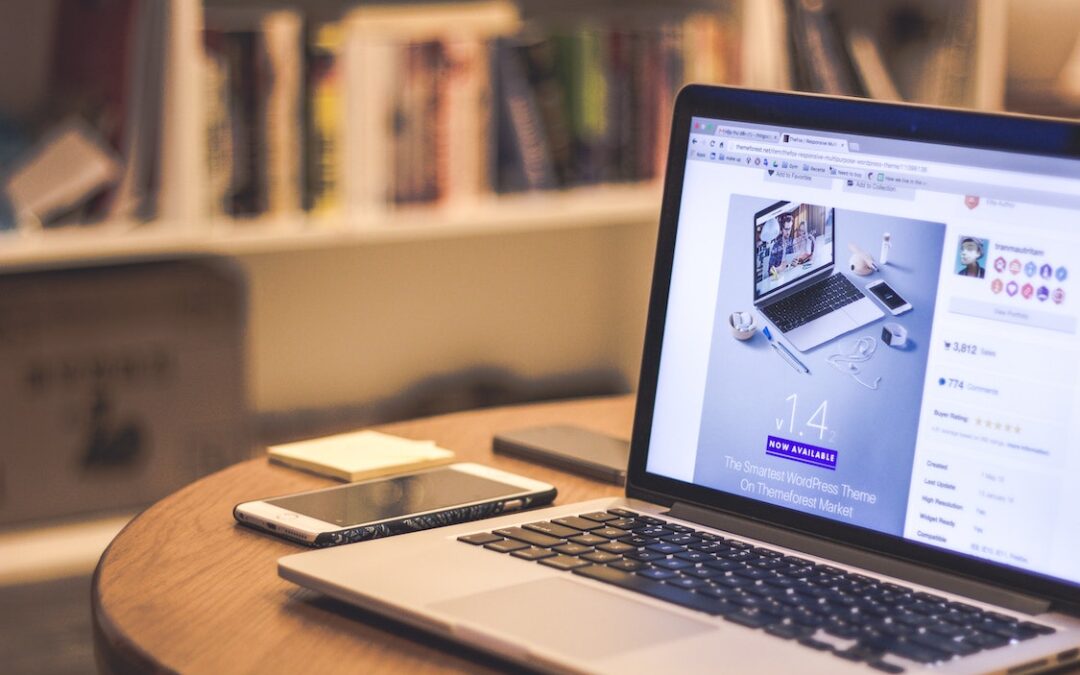 A laptop and phone beside it