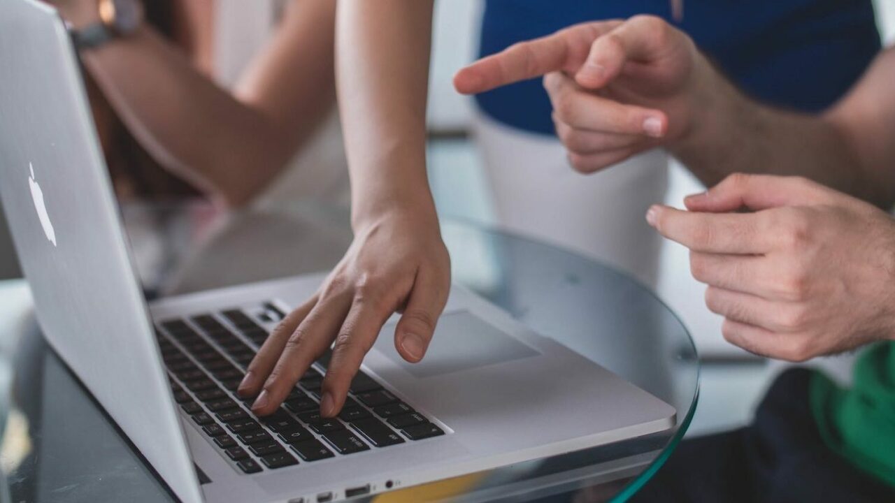 Hands on a laptop