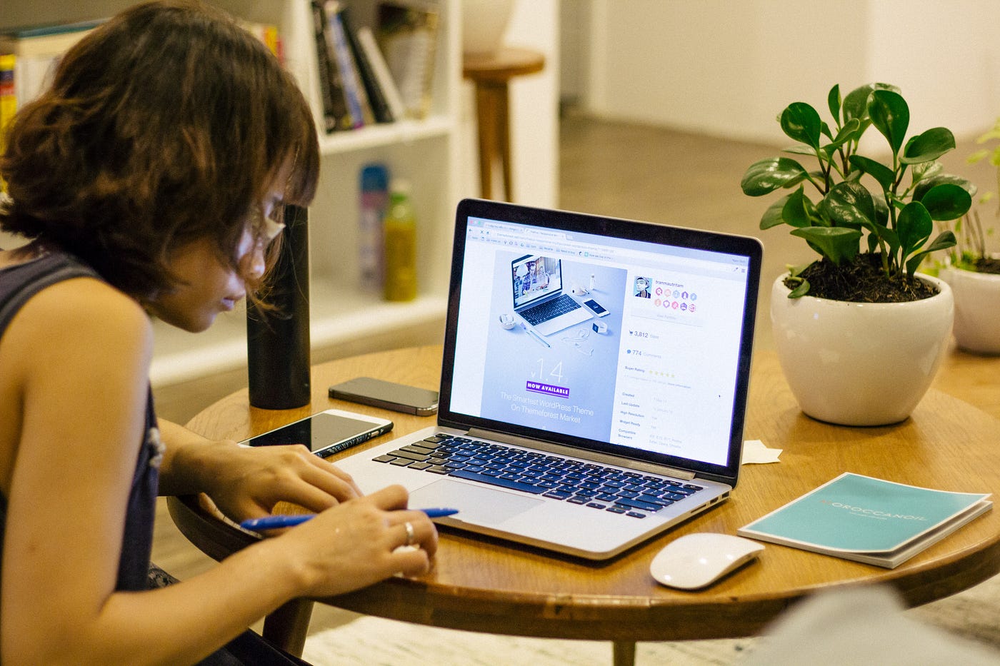 A woman typing on a laptop