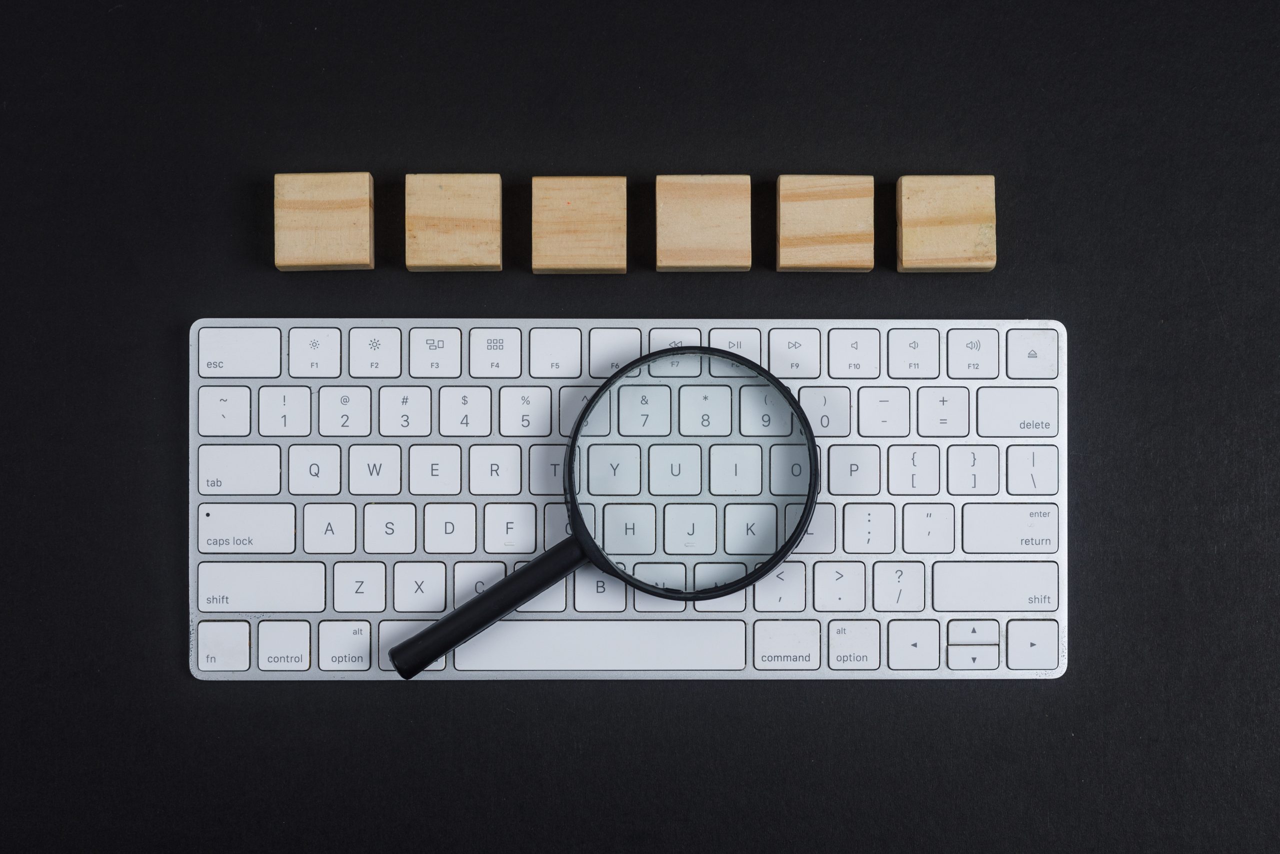 Keyboard with magnifying glass on top
