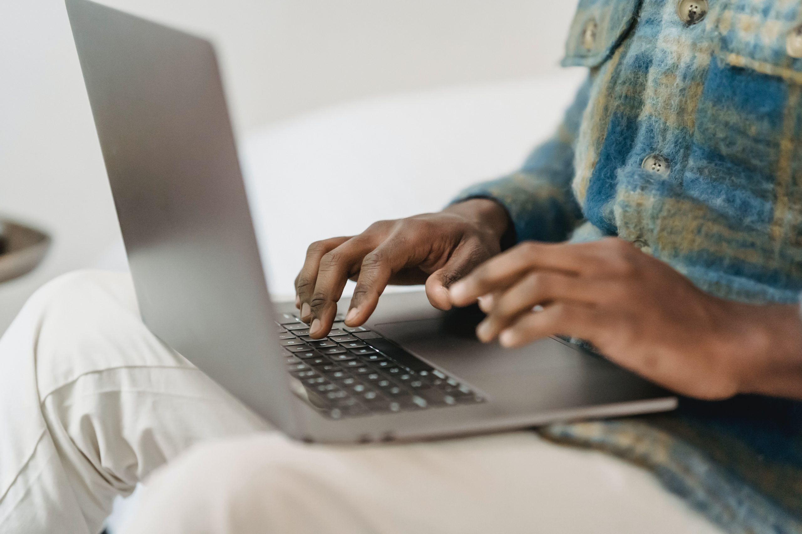 A laptop on a man's lap