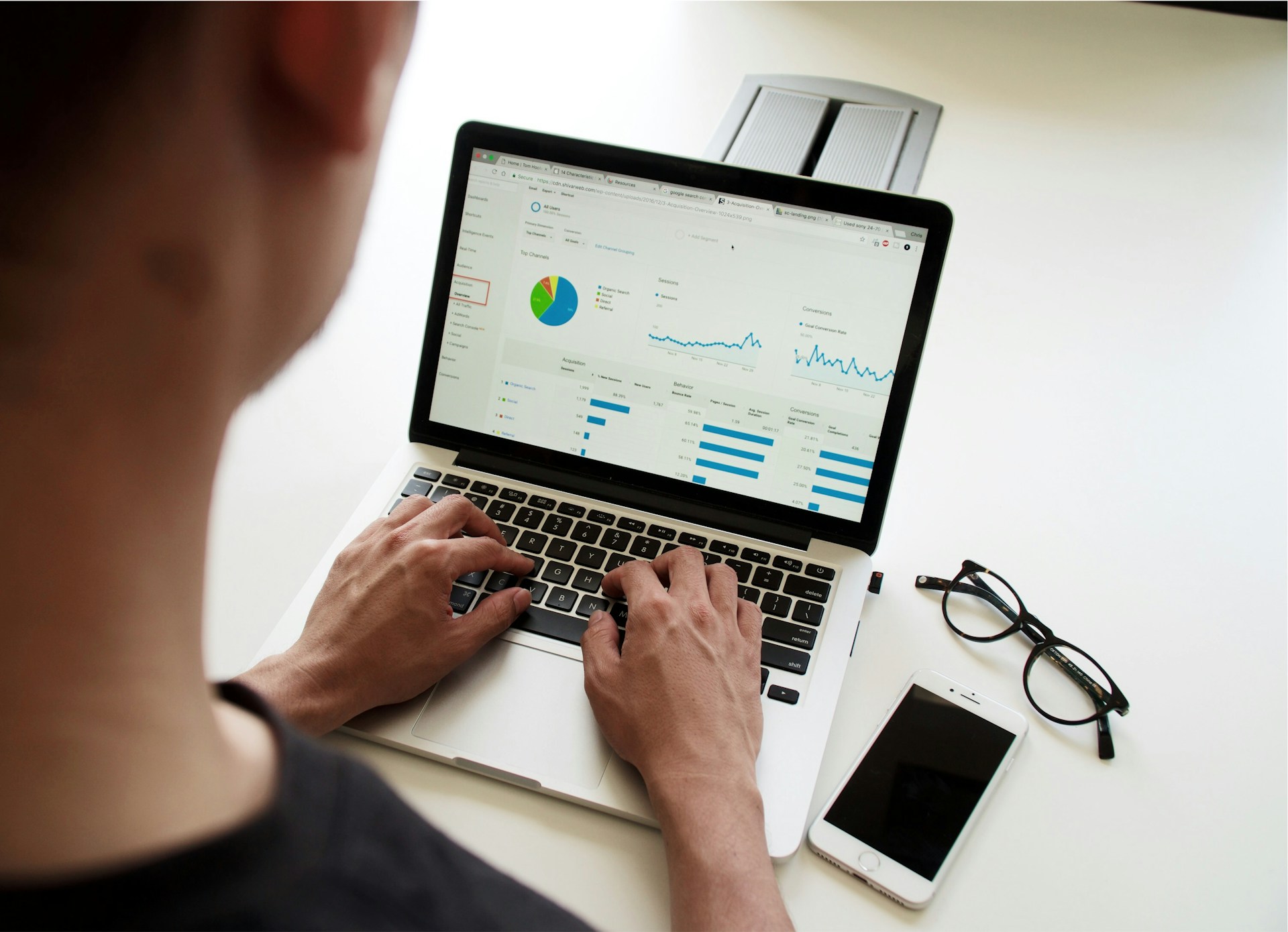 A man checking his website analytics on his laptop