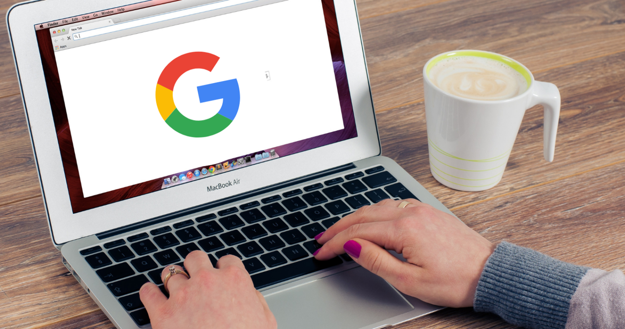 Hands on a laptop with Google logo