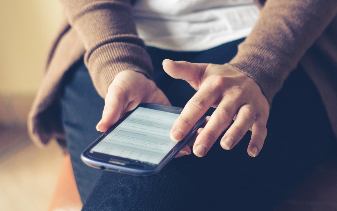A person scrolling on phone